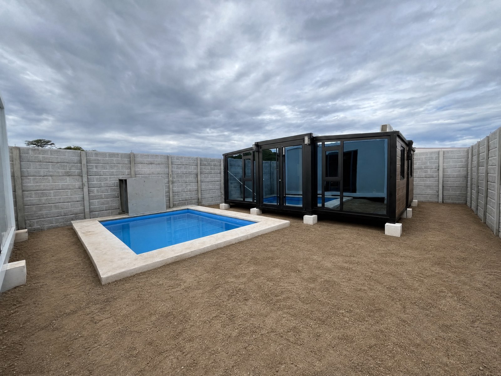 Glass-walled Daruma Kuro next to the compound’s private pool